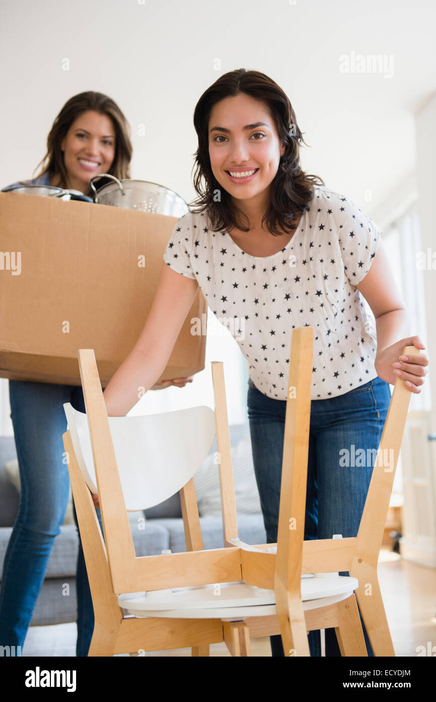 Hispanic women moving house Stock Photo