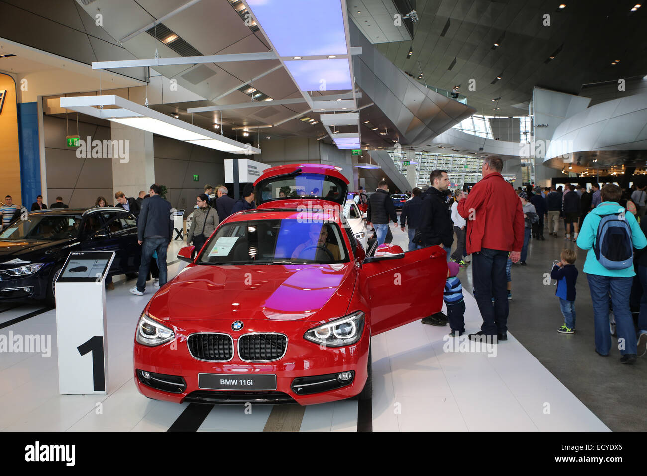 red bmw car show inside bmw world museum tourist people Stock Photo