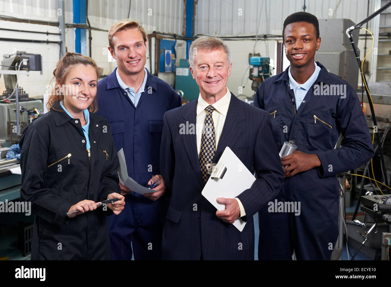 Portrait Of Manager And Staff In Engineering Factory Stock Photo