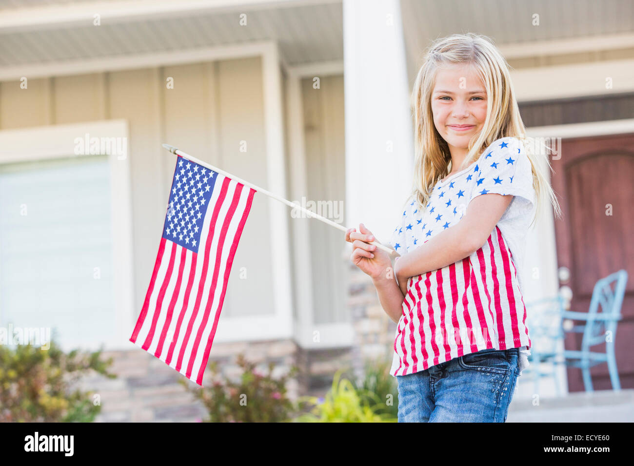 American flag front of house hi-res stock photography and images - Alamy