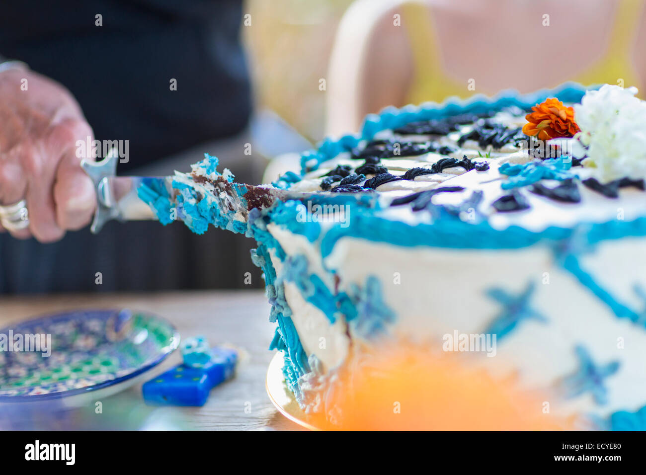 Mature woman cutting birthday cake hires stock photography and images