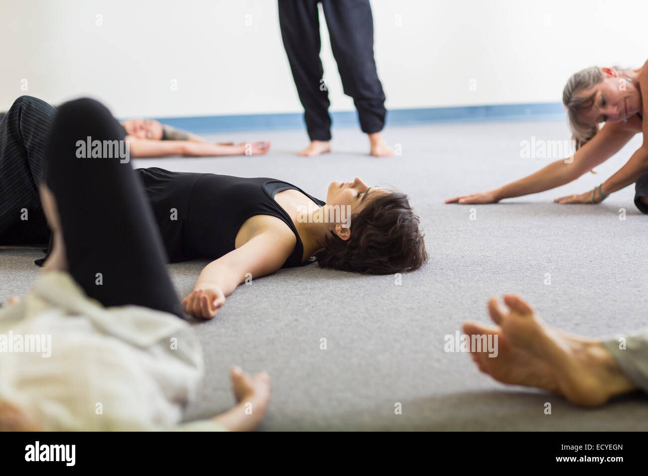 Students stretching in acting class Stock Photo
