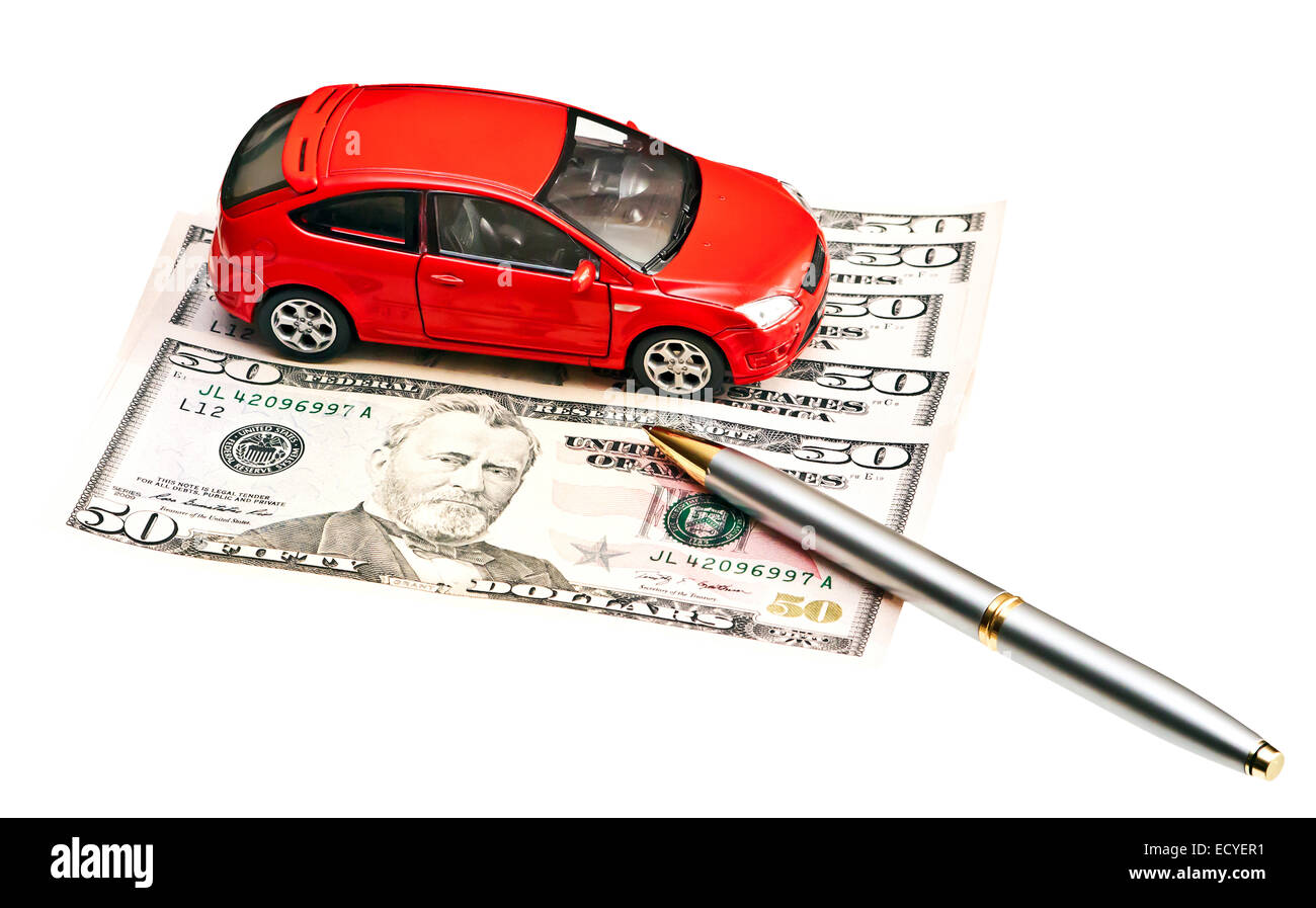 Car, pen and money. Concept for buying, renting, insurance, fuel, service and repair costs Stock Photo