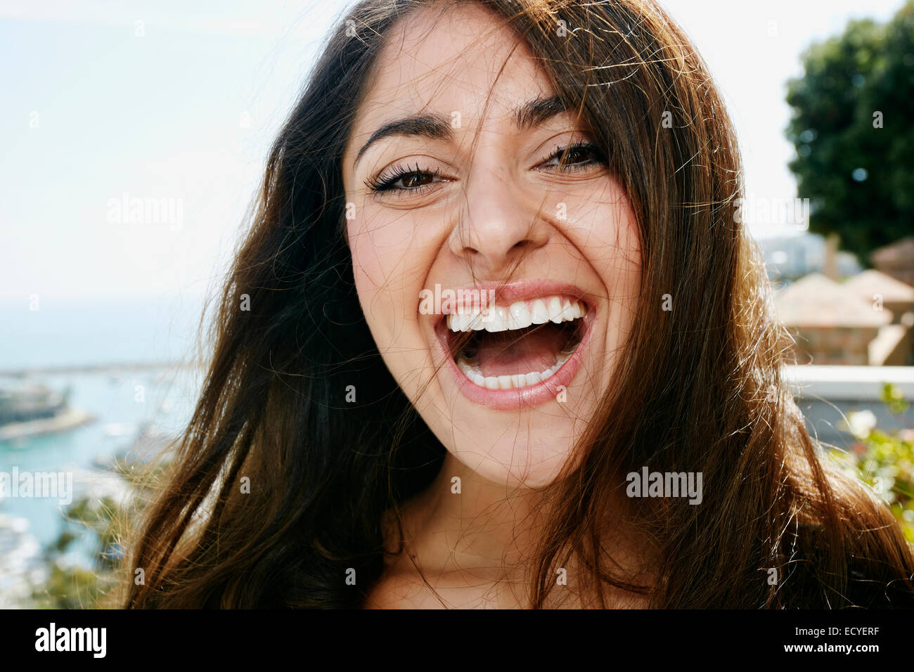 Close up of mixed race woman laughing Stock Photo