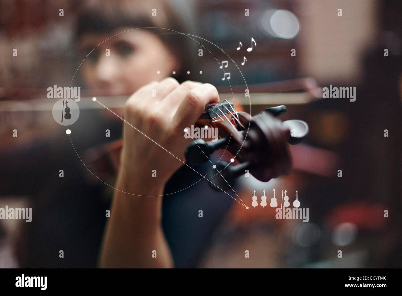 Caucasian woman playing violin overlaid with graphic design Stock Photo