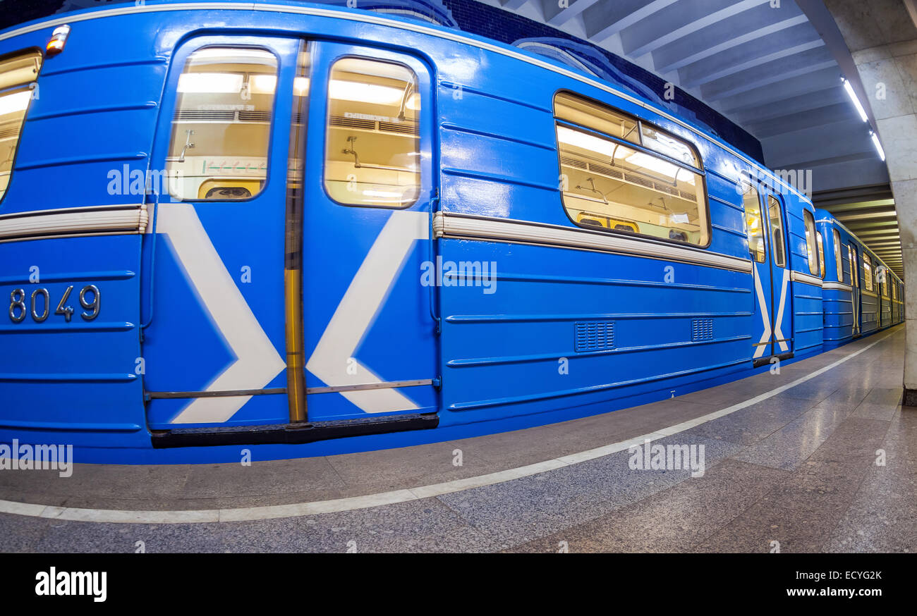 Blue subway train standing at the underground station. Wide angle Stock ...