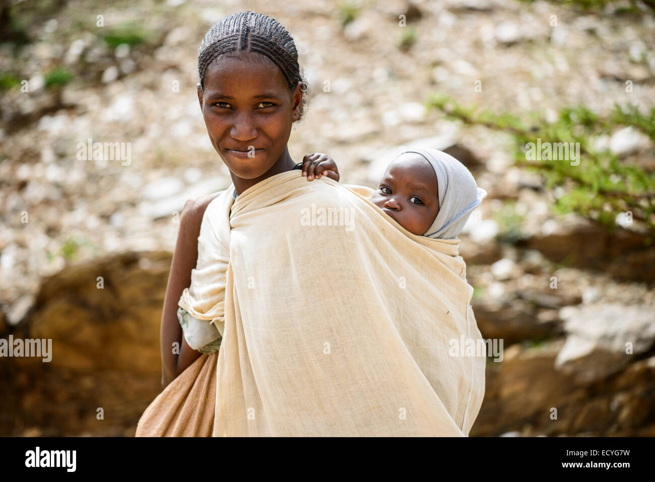 Tigrayan woman carrying her baby, Ethiopia Stock Photo