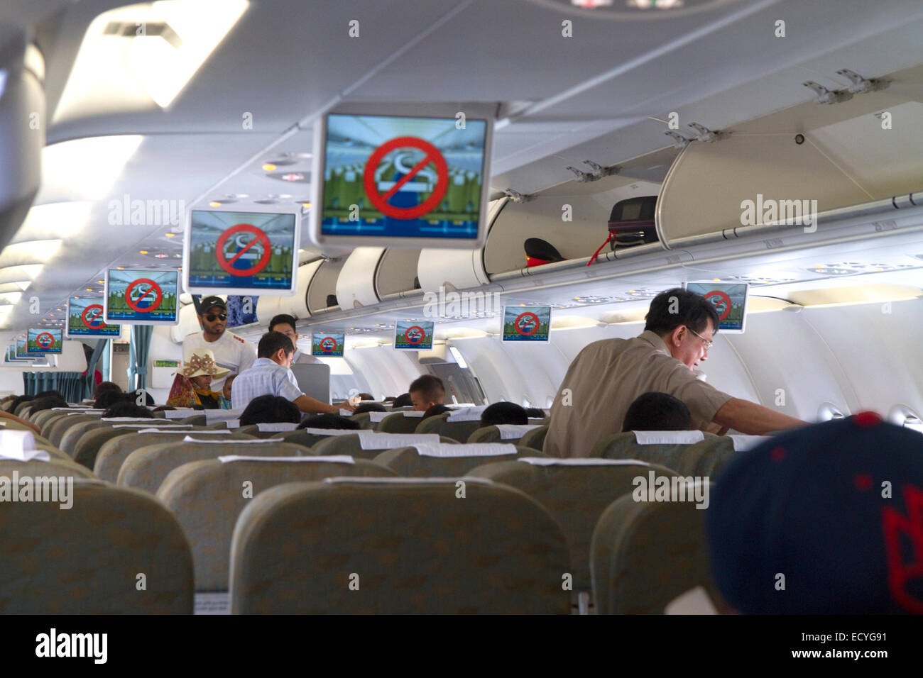 Safety briefing aboard a Vietnamese Airlines Airbus 320 at Cam Ranh International Airport, Cam Ranh, Vietnam. Stock Photo