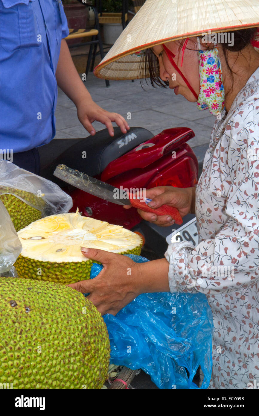 Vietnamese street vendor selling durian fruit in Hanoi, Vietnam. Stock Photo