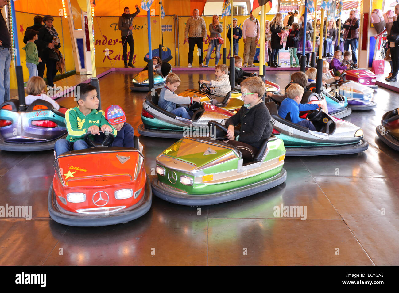 kids children play bumper car amusement park Stock Photo