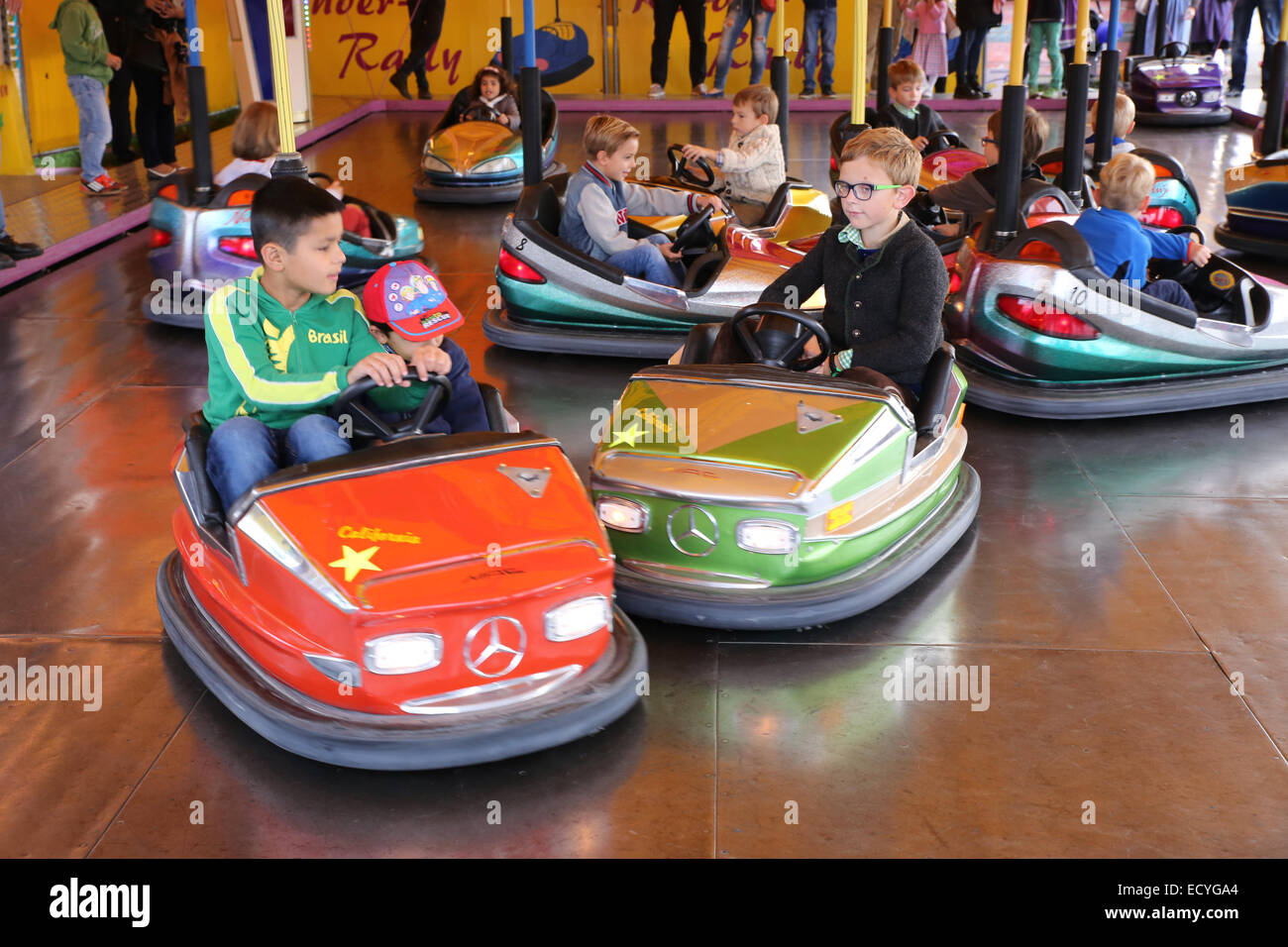 young boy bumper car amusement park Europe Stock Photo