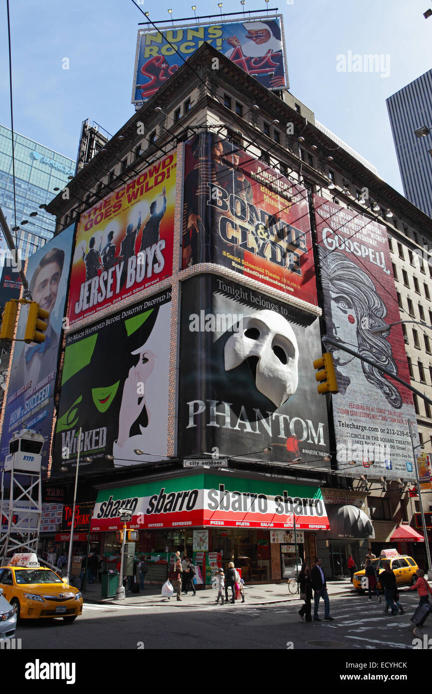 Huge billboards in Times Square New York advertise shows in the theater district along 7th Avenue Stock Photo