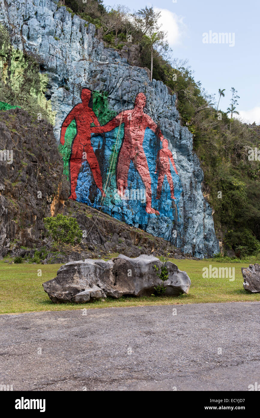 On a cliff at the foot of the 617m-high Sierra de Vinales,Cuba, the Mural de la Prehistoria is a 120m-long painting on the side Stock Photo