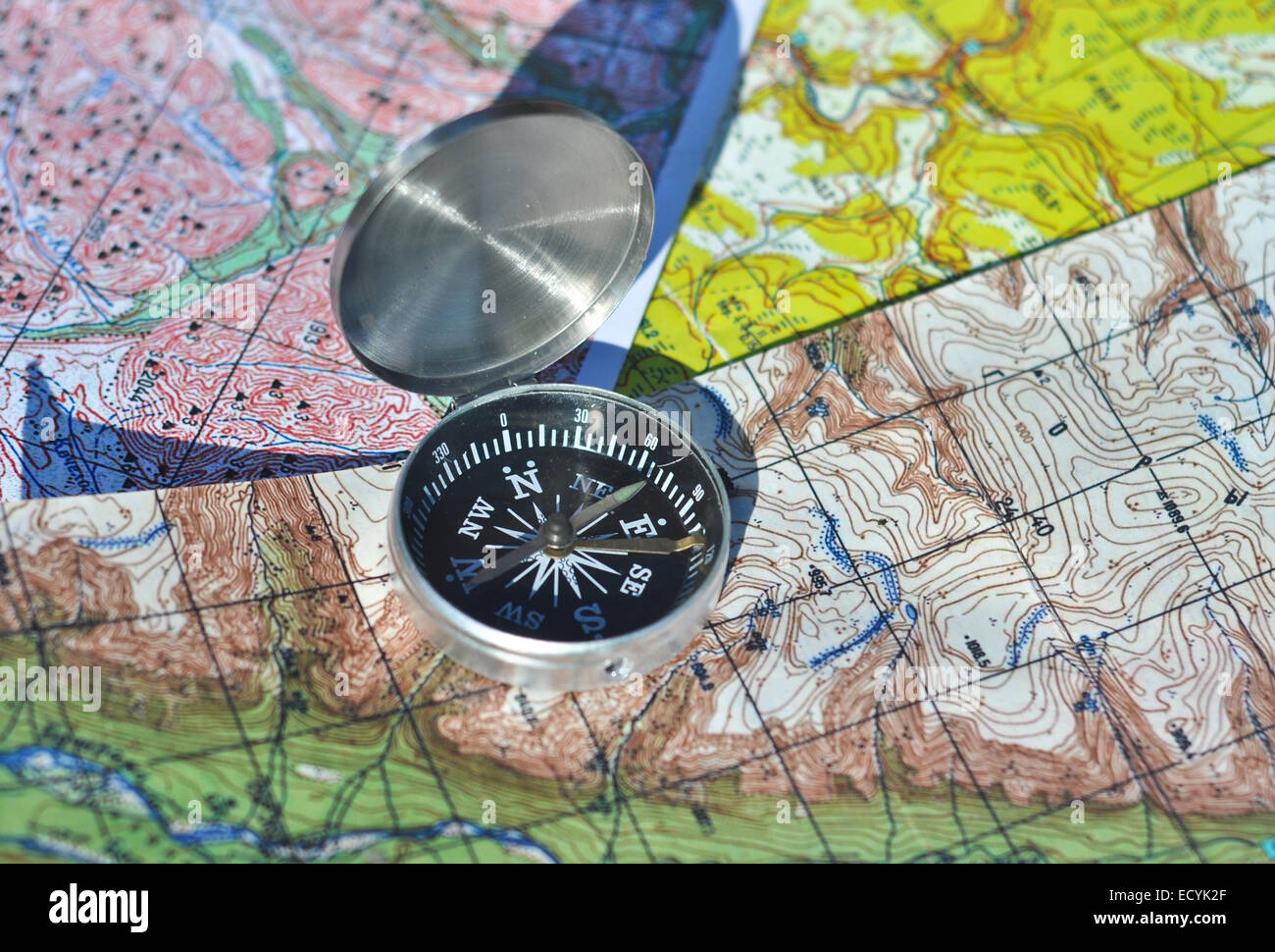 Map and compass. The magnetic compass is located on the topographic map ...