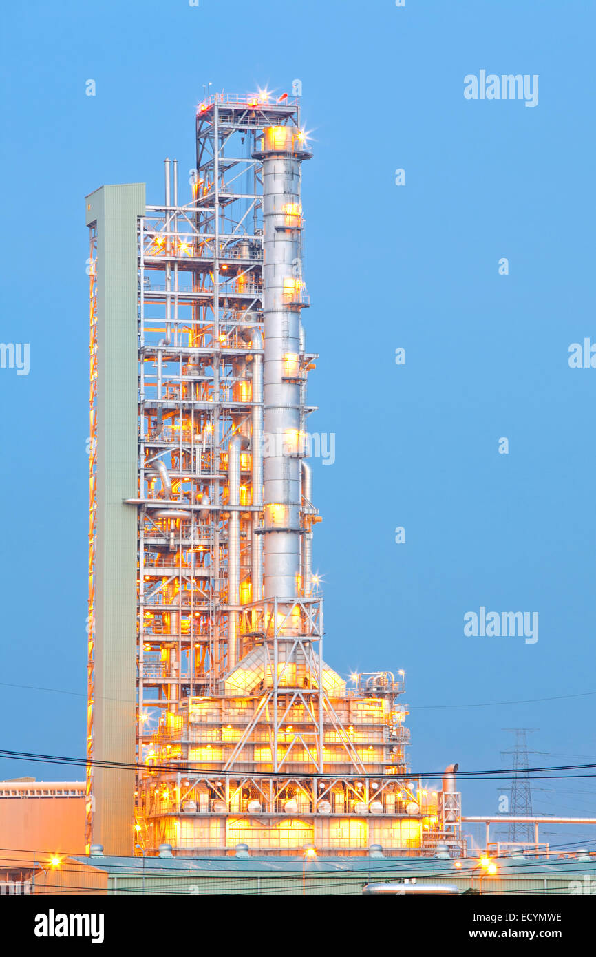 Distillation tower at Oil Refinery Plant at dusk Stock Photo - Alamy
