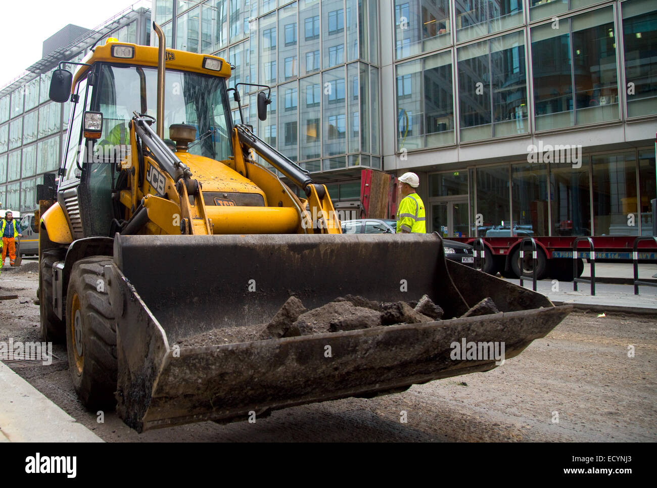 LONDON - OCTOBER 18TH: Unidentified workman operates a JCB on October 18th, 2014 in London, England, UK. JCB is one of the world Stock Photo