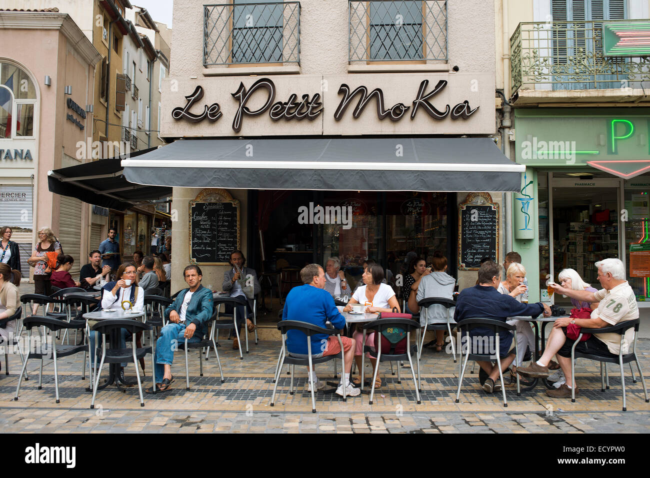 Le Petit Moka bar restaurant at Town hall square. Narbonne. Pedestrian shopping street in old city central Narbonne. South of Fr Stock Photo