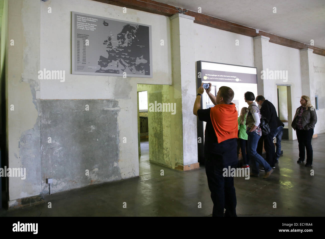 tourists inside Dachau concentration camp museum Stock Photo