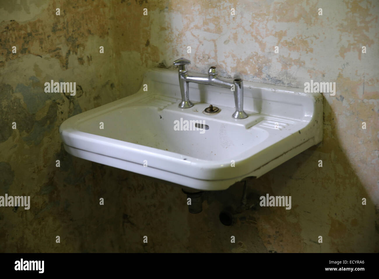broken bathroom faucet concentration camp world war two Stock Photo