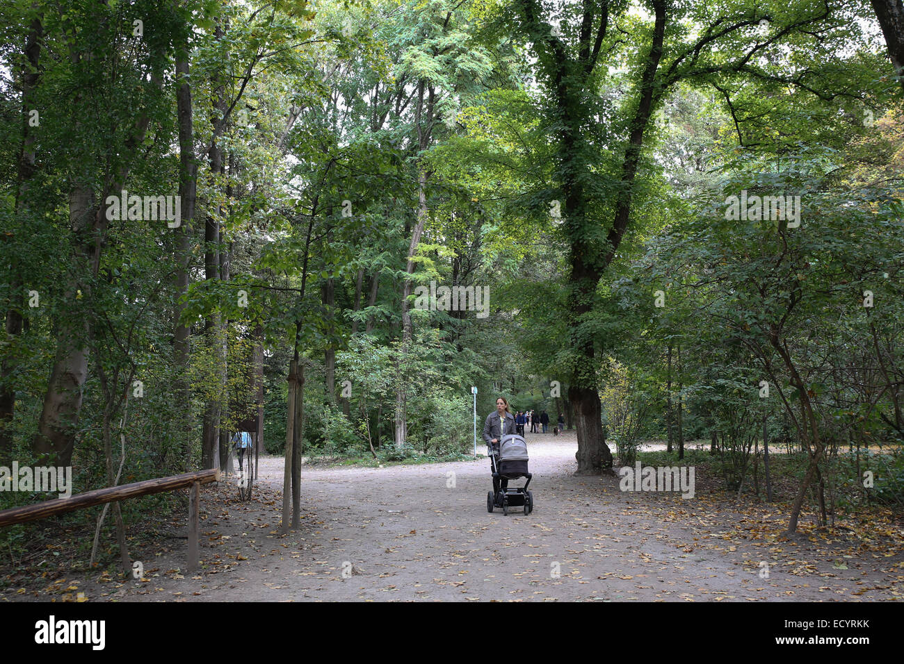 mother stroller inside Munich Englischer Garten Stock Photo