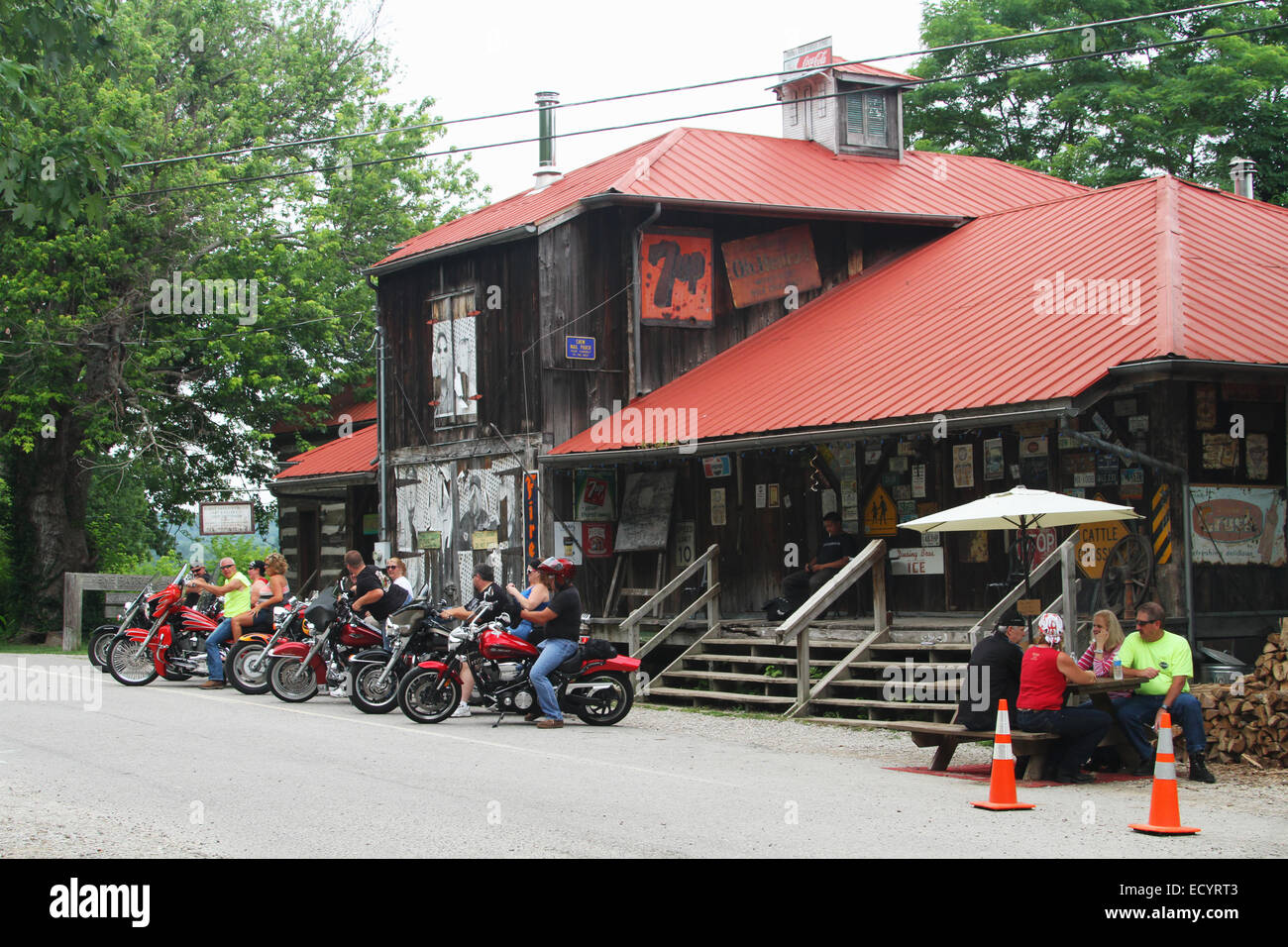 Motorcycle riders enjoy a rest stop at Rabbit Hash, Kentucky, USA. Circa 1813. A historic small town on the Ohio River. Added to Stock Photo