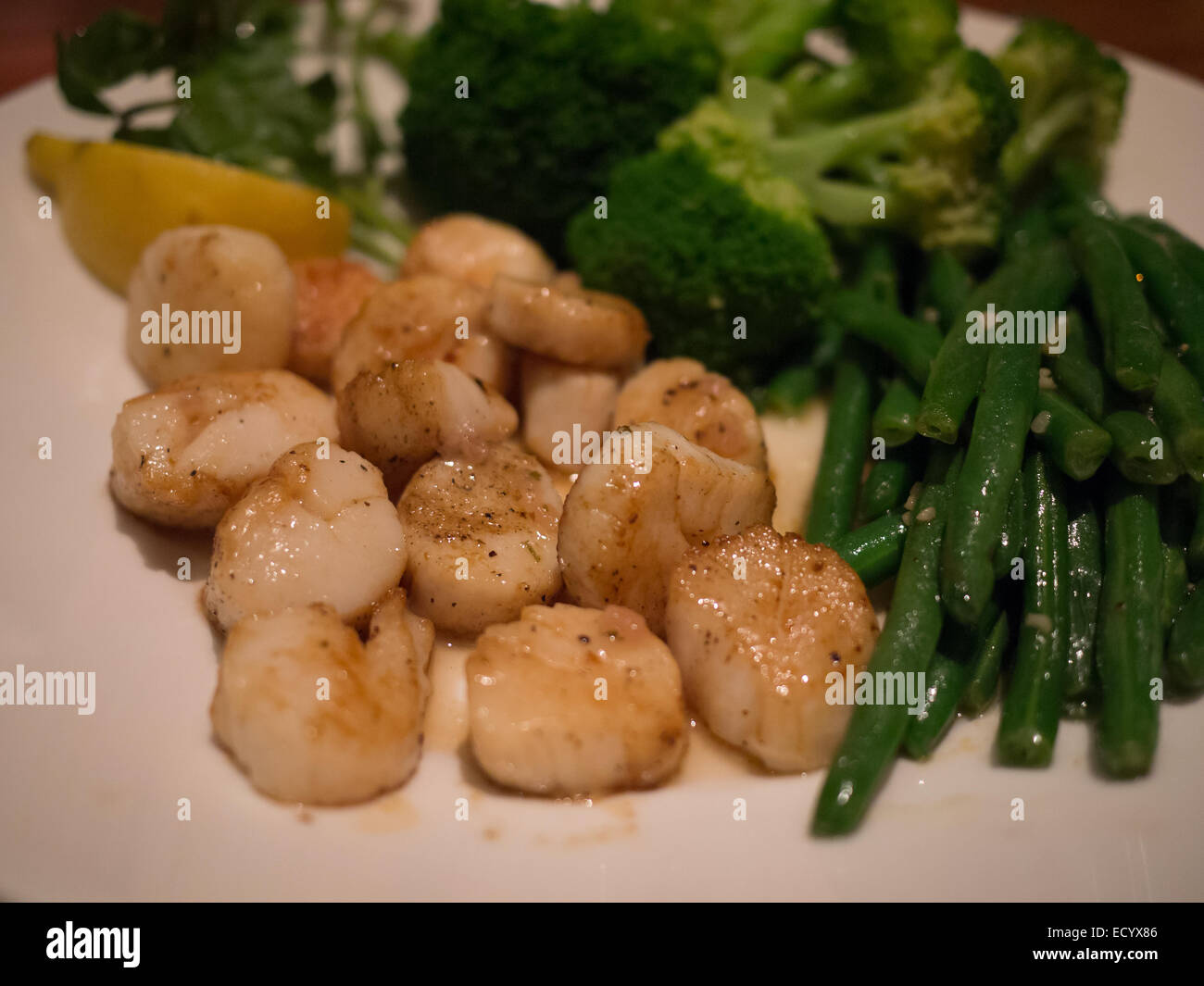 fried scallops green beans broccoli dinner Stock Photo