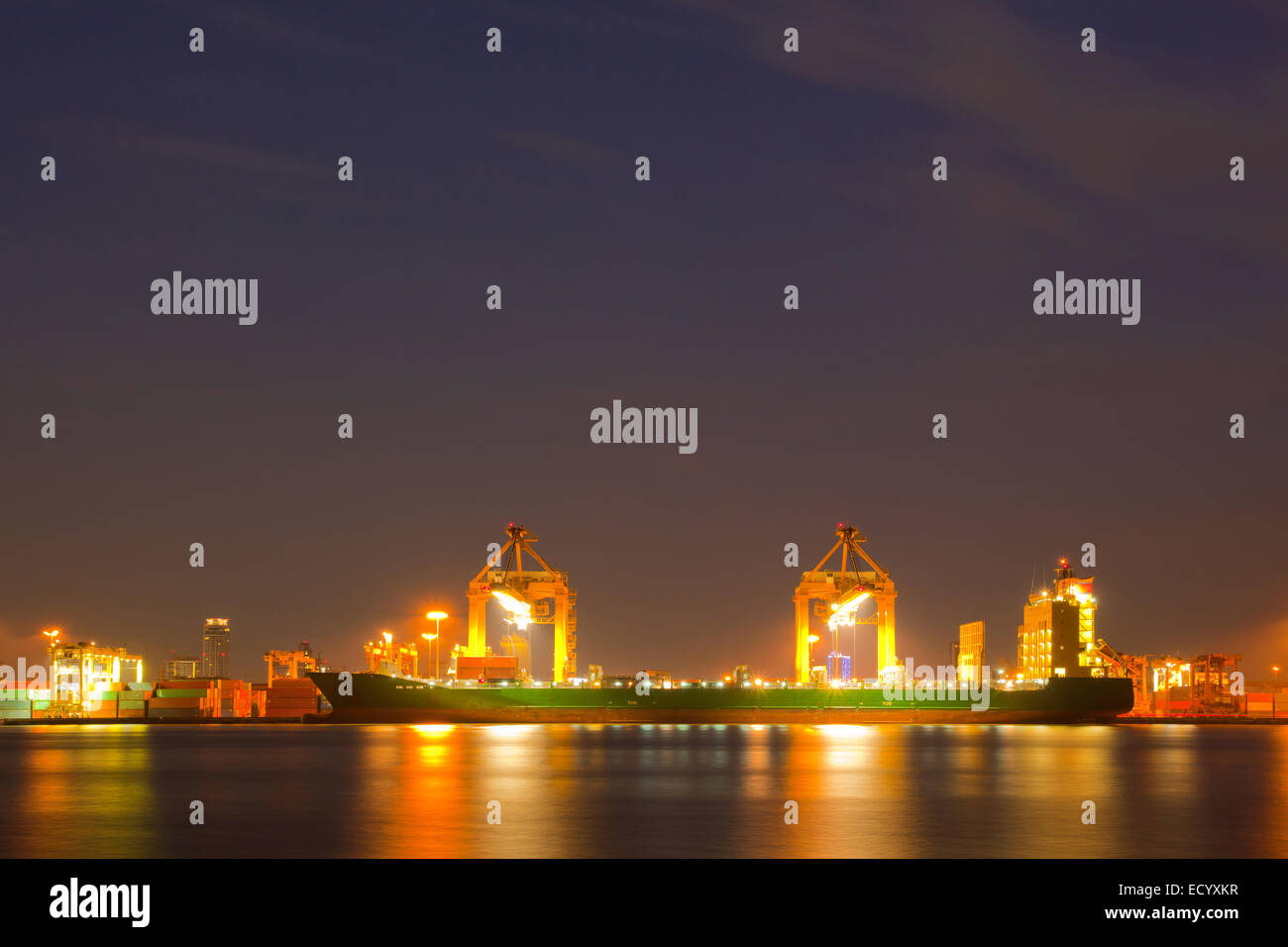 Container Cargo freight ship with working crane bridge in shipyard at ...