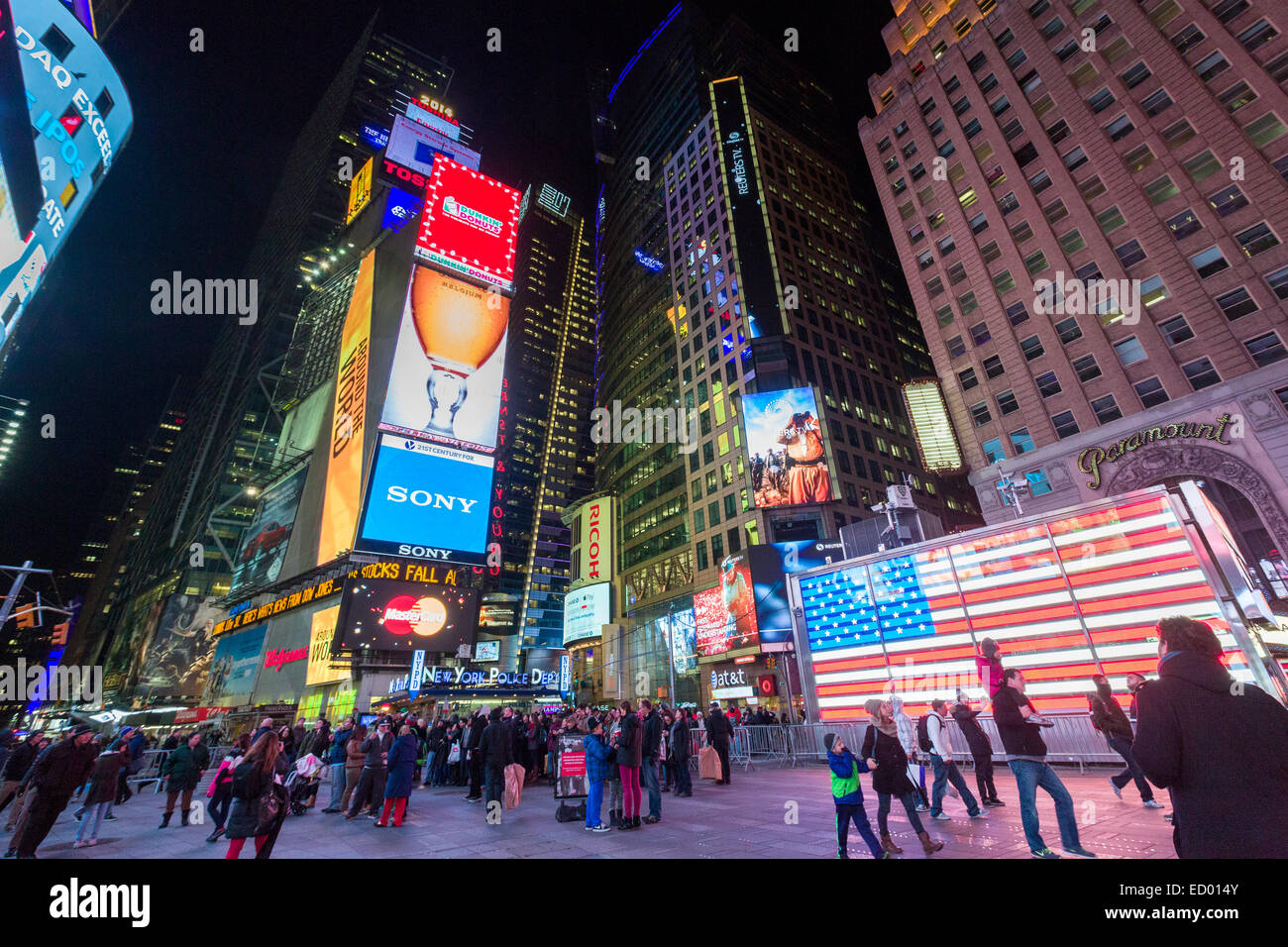 Pedestrians view the lights in Times Square December 15, 2014 in New