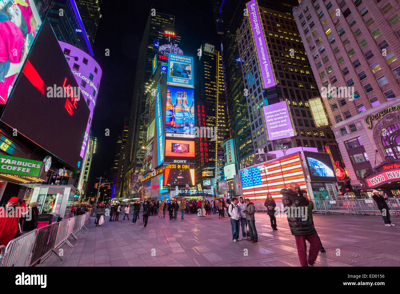 Pedestrians view the lights in Times Square December 15, 2014 in New York City, NY. Stock Photo