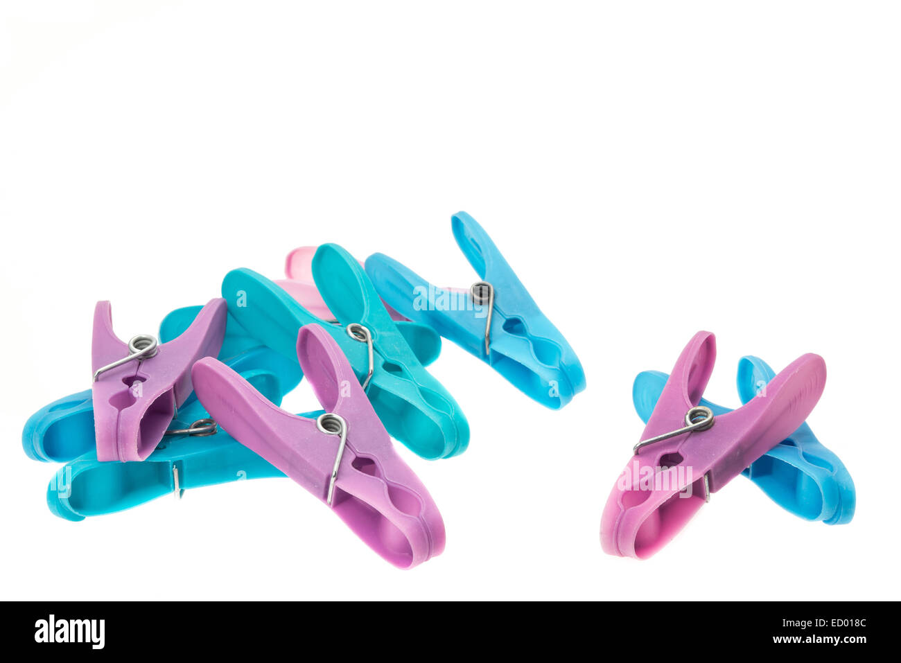 Plastic clothes pegs - white background Stock Photo