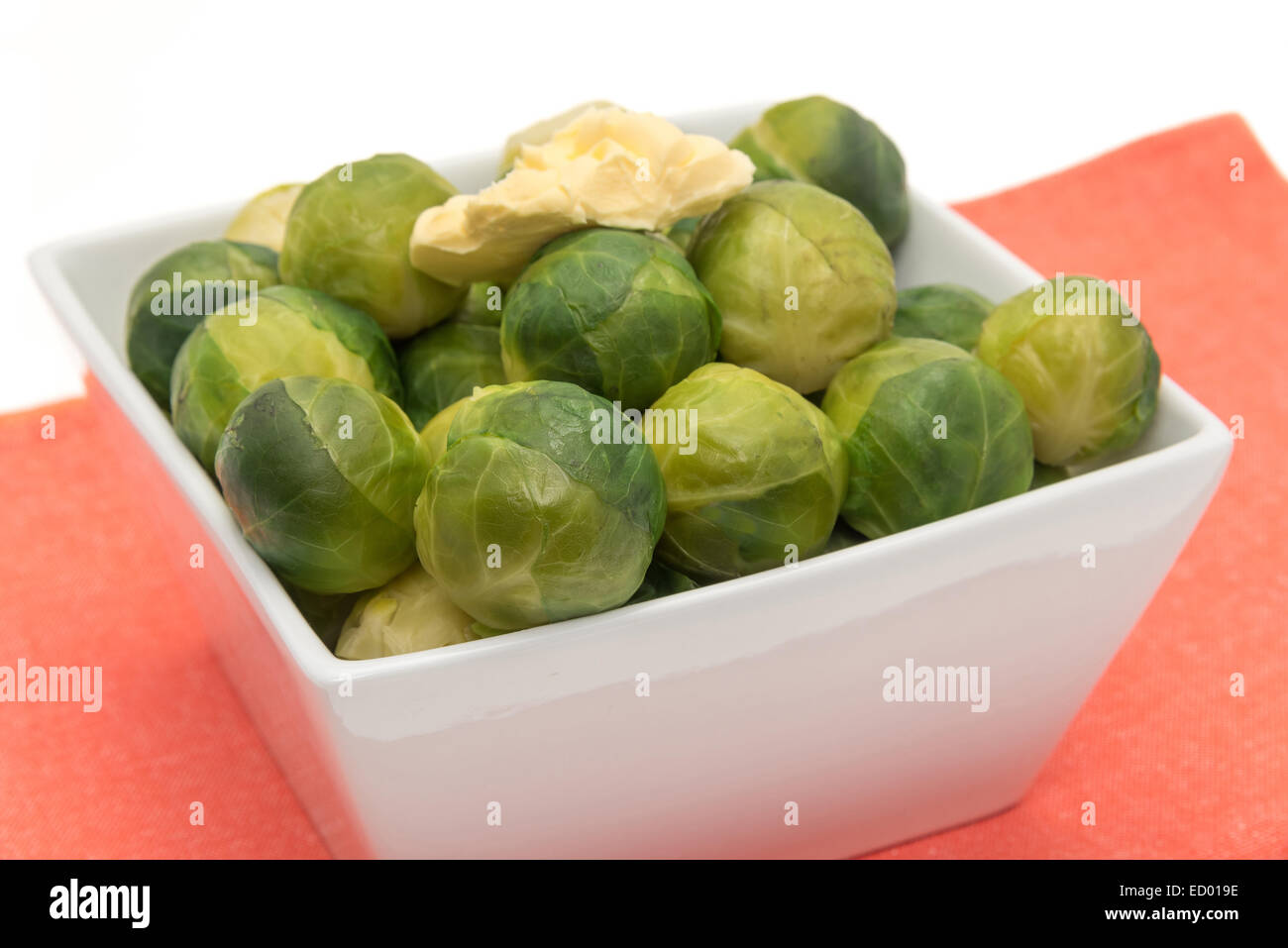 Cooked Brussel Sprouts with a knob of butter Stock Photo