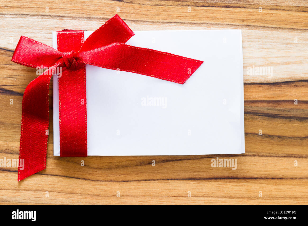 Notes With Ribbon view form a hove of a blank note with a red ribbon and a bow for a ...