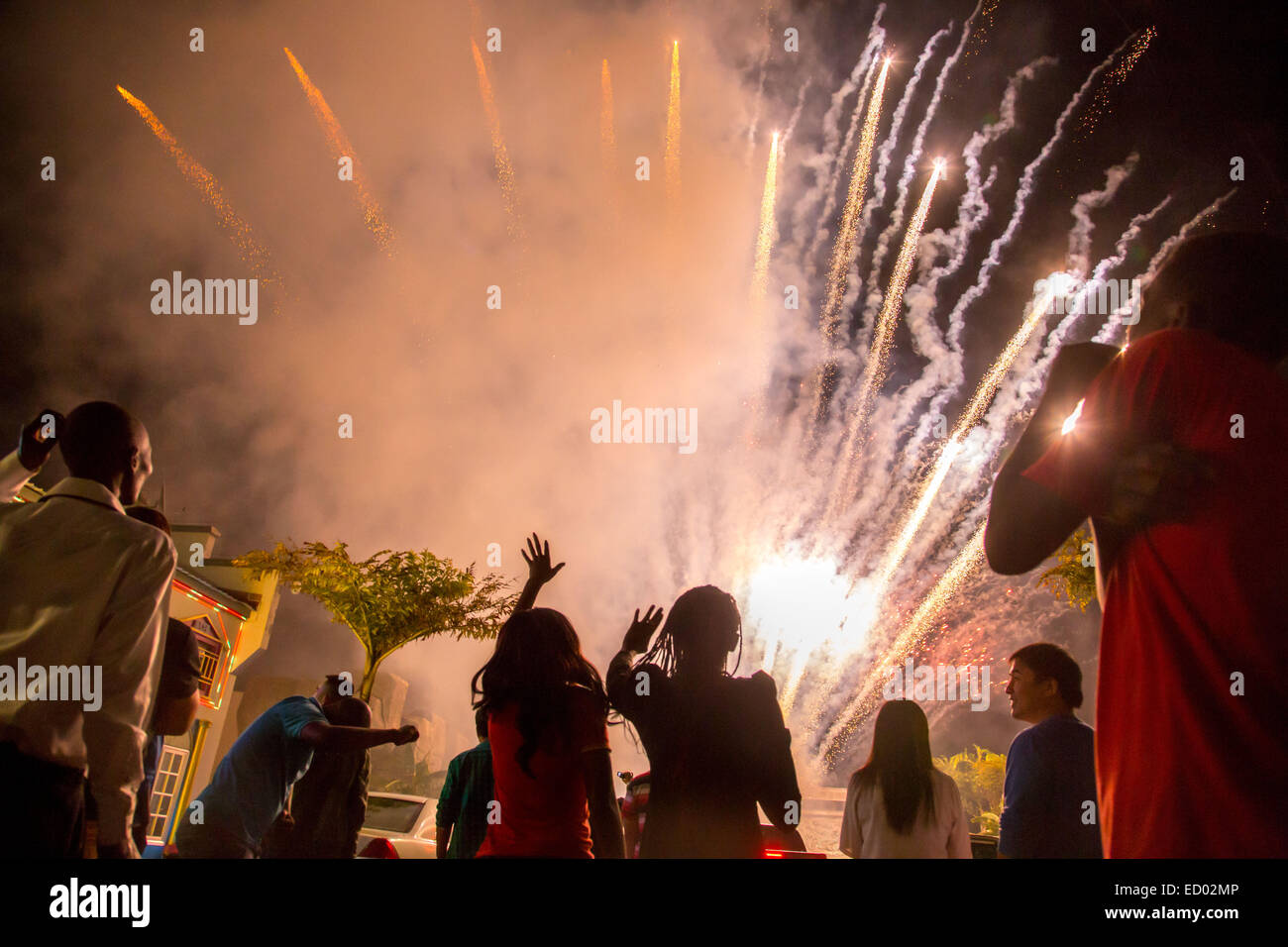 Harare, Zimbabwe. 22nd Dec, 2014. Zimbabweans cheer as fireworks blast