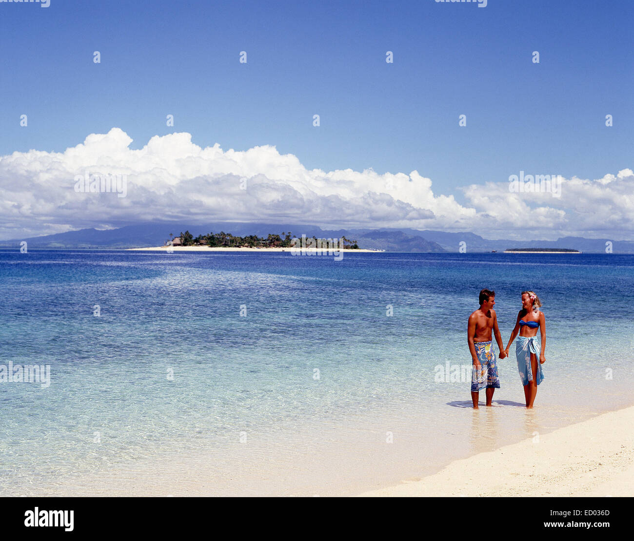 Young couple on tropical beach, Beachcomber Island Resort, Beachcomber Island, Mamanuca Islands, Viti Levu, Republic of Fiji Stock Photo