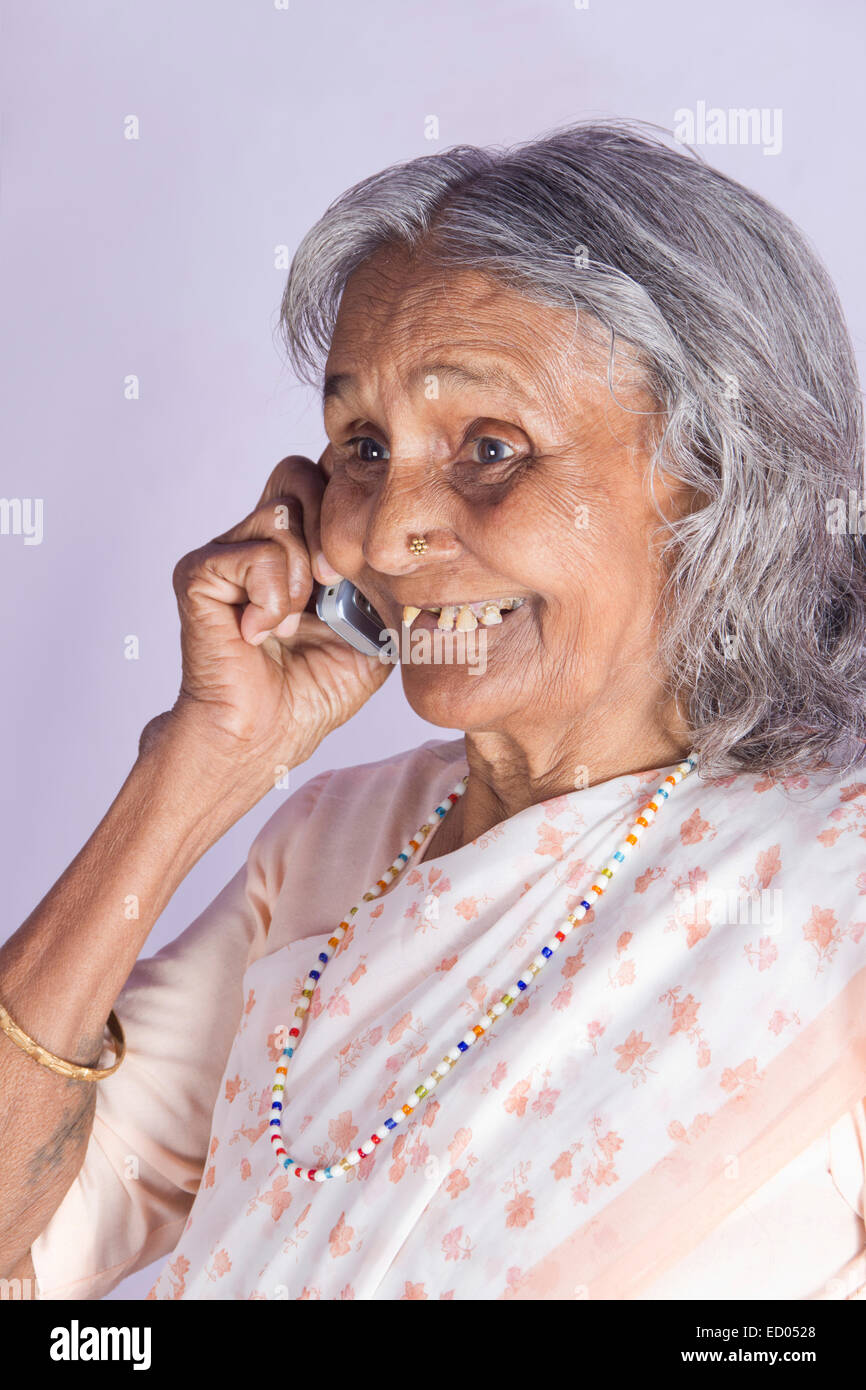 1 indian Old Senior Woman talking phone Stock Photo