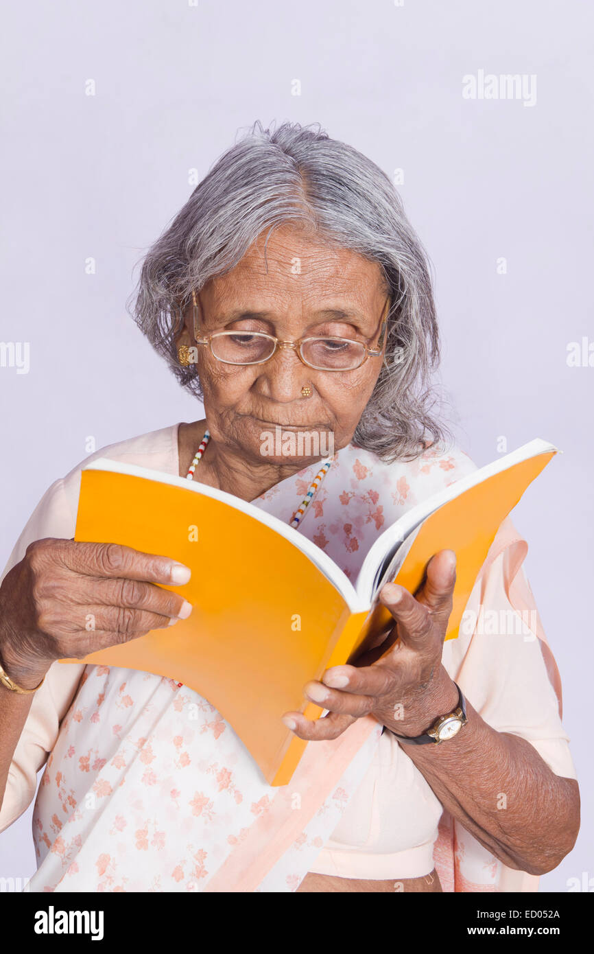1 indian Old Senior Woman reading Book Stock Photo