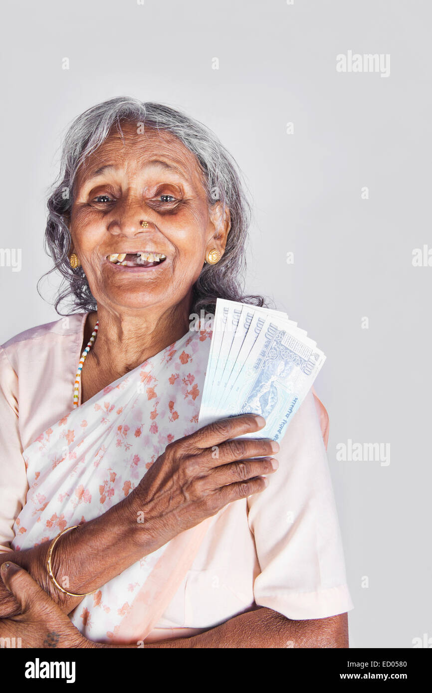 1 indian Old Senior Woman Saving money Stock Photo
