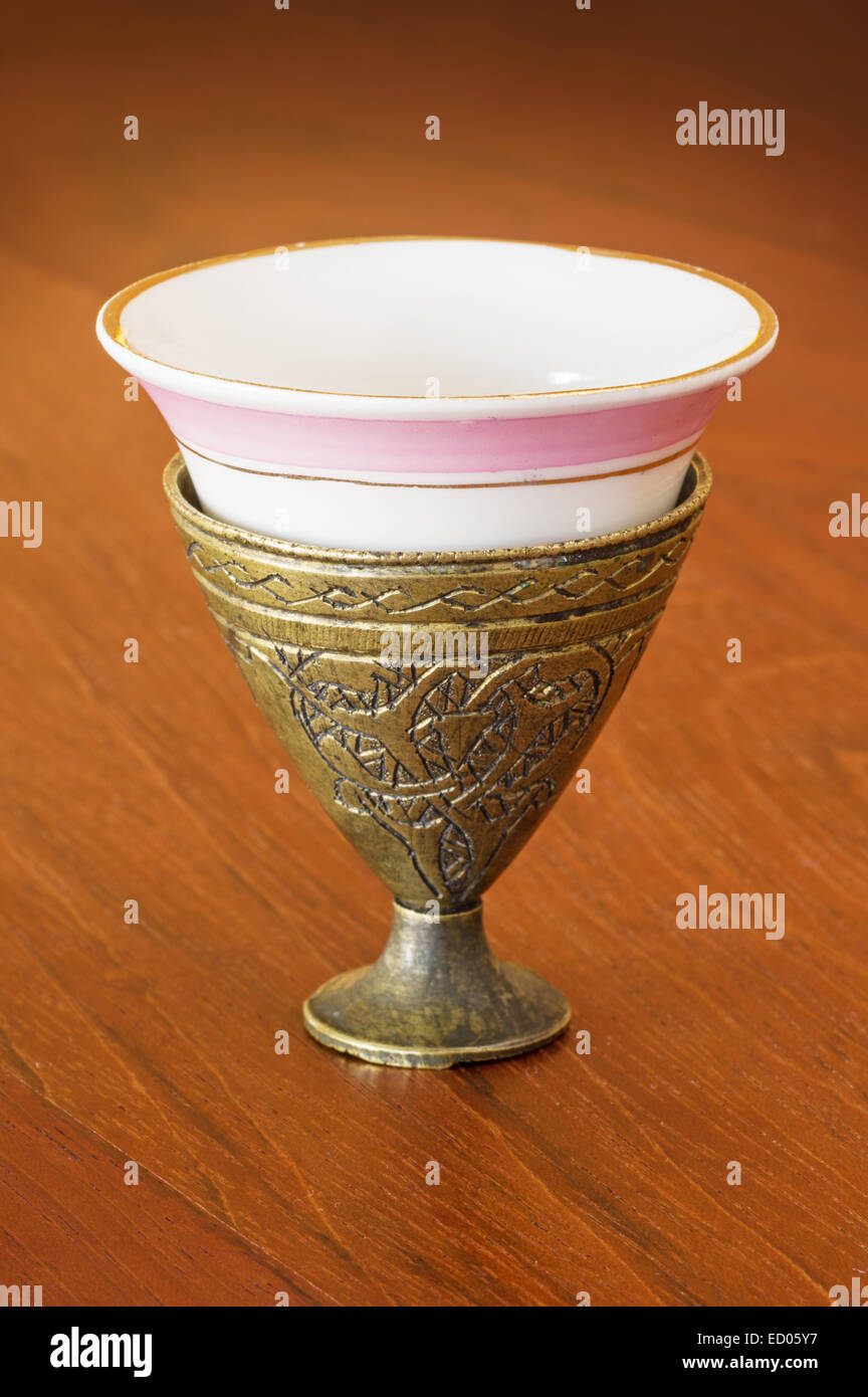 antique Turkish brass zarf with porcelain coffee cup Stock Photo