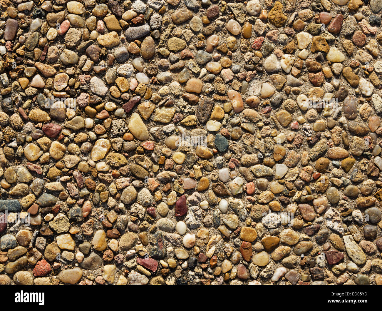 exposed aggregate concrete with rounded pebbles background texture Stock Photo