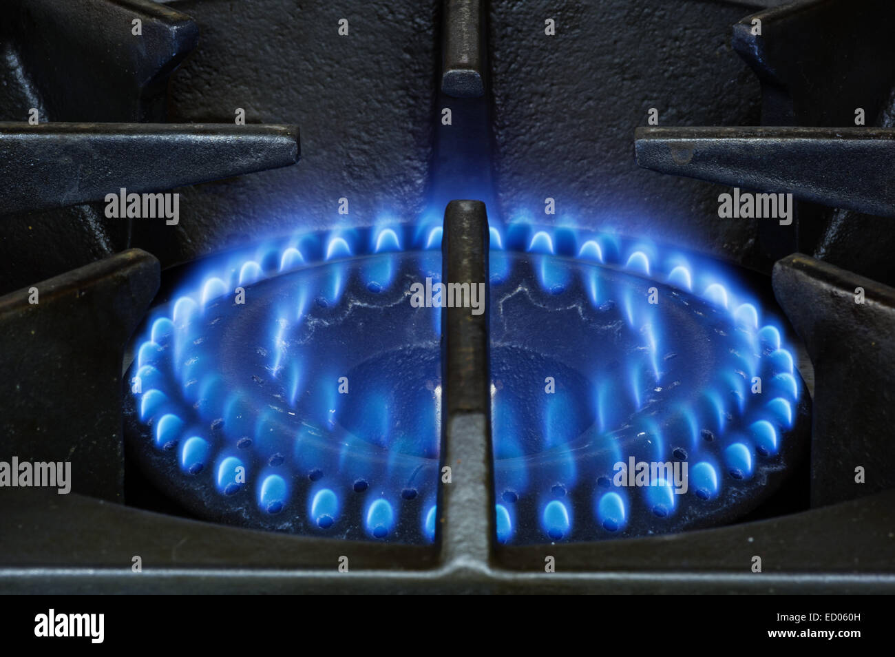 heavy duty natural gas stove burner with blue flames Stock Photo