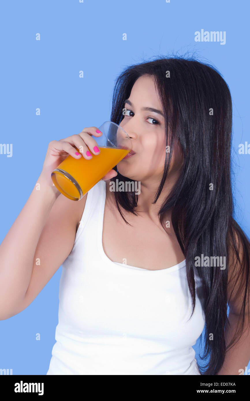1 indian Beautiful  Lady Drinking Fruit Juice Stock Photo