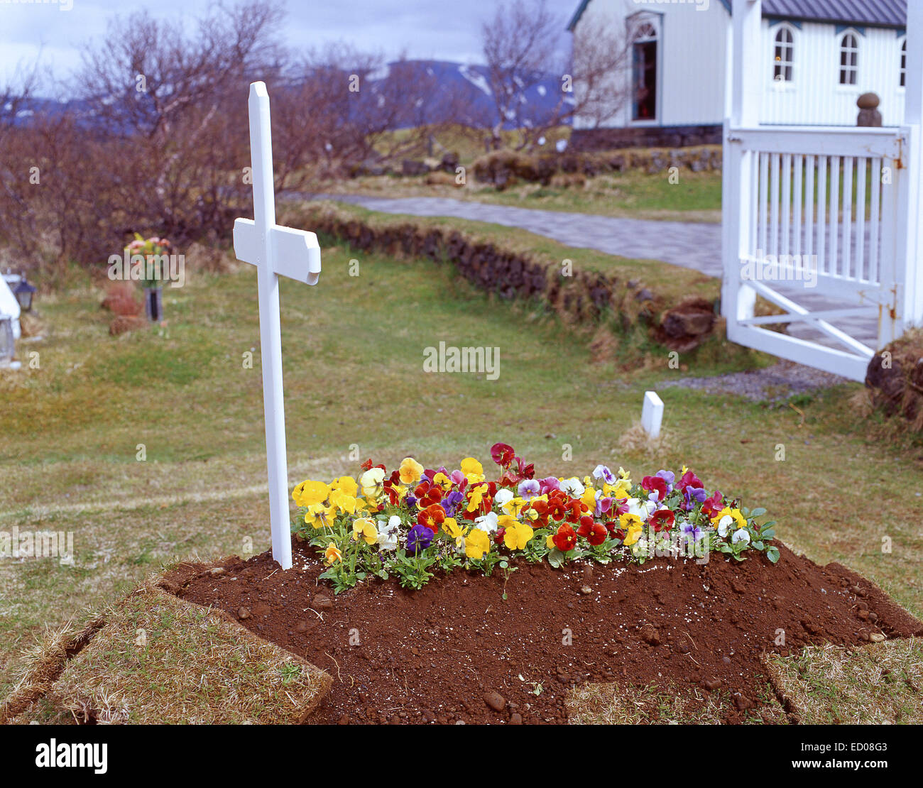 Recent 'laid to rest' grave in small church graveyard, Capital Region, Republic of Iceland Stock Photo