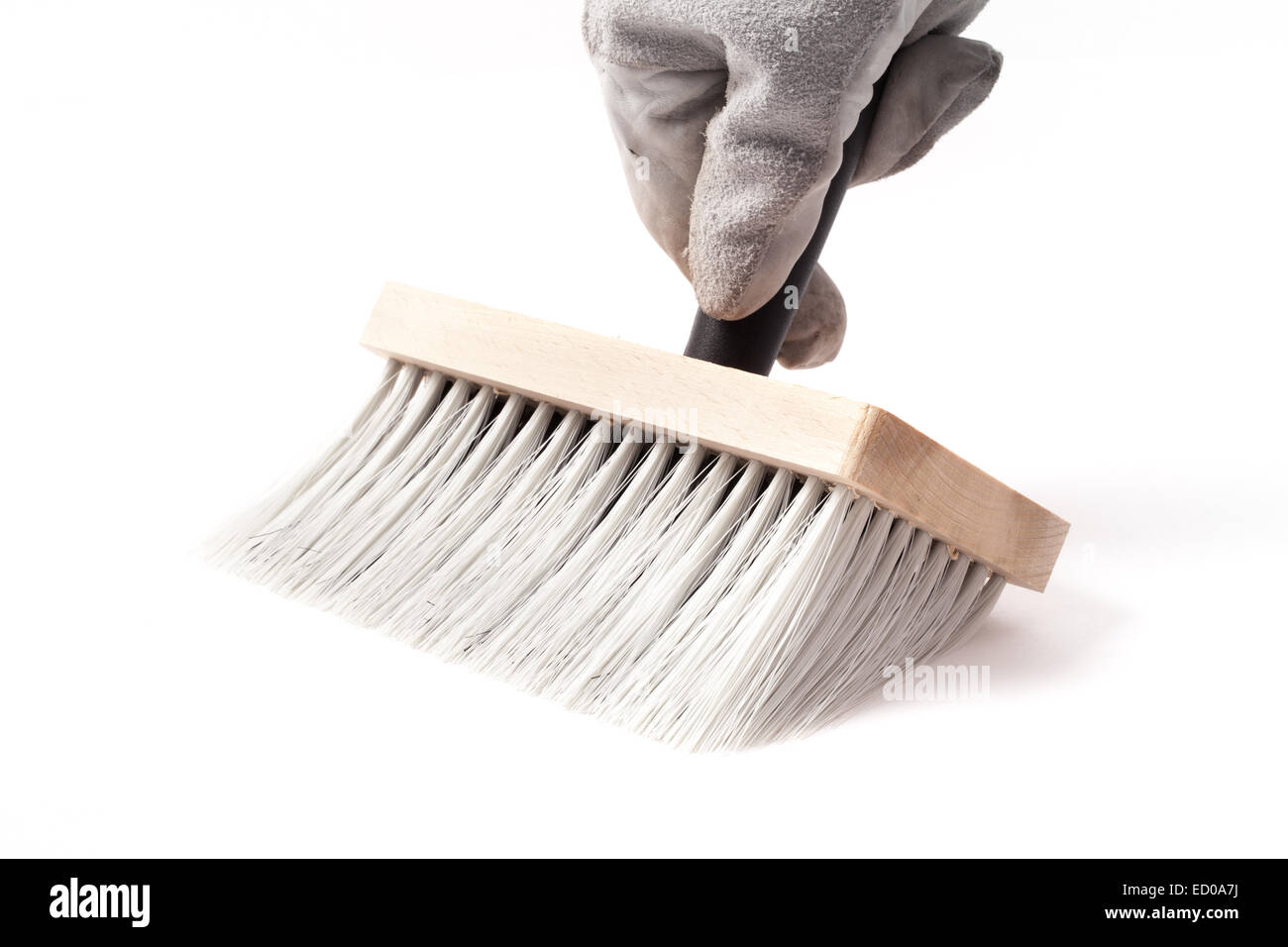 Big paintbrush in hand isolated on white background Stock Photo - Alamy