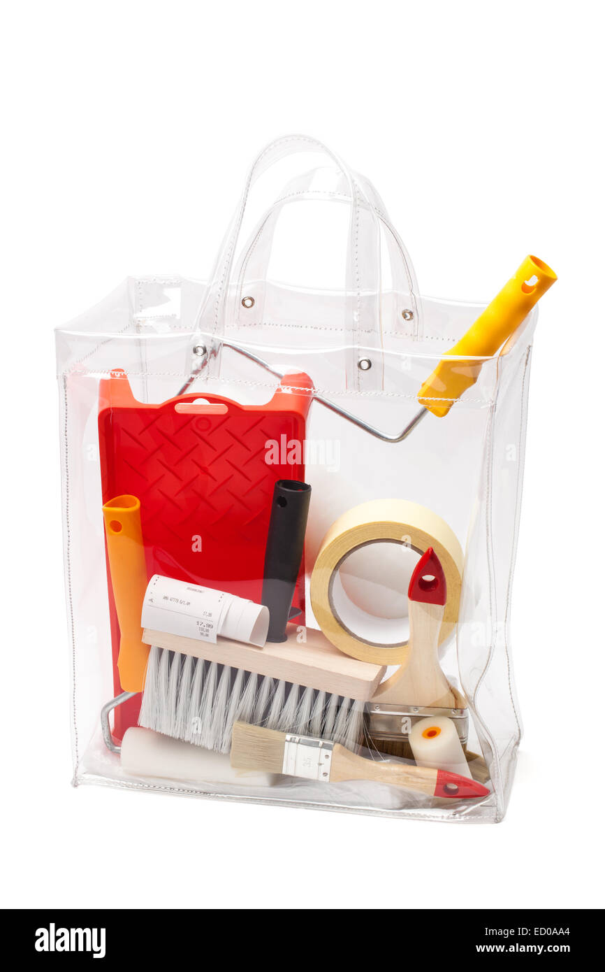 Plastic bag with painting tools and accessories isolated on white. Stock Photo