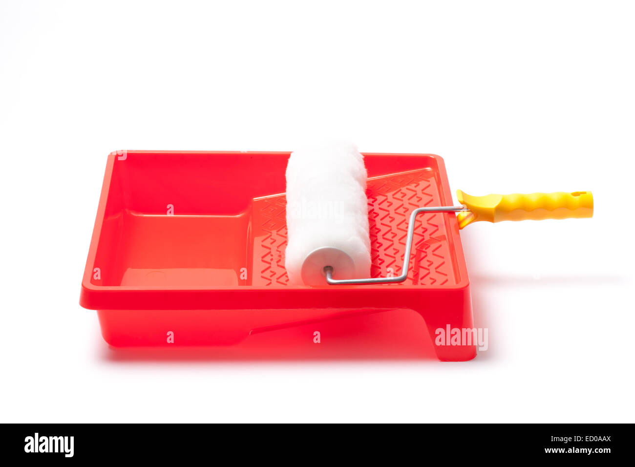 Photo of a paint tray and roller isolated on white background Stock