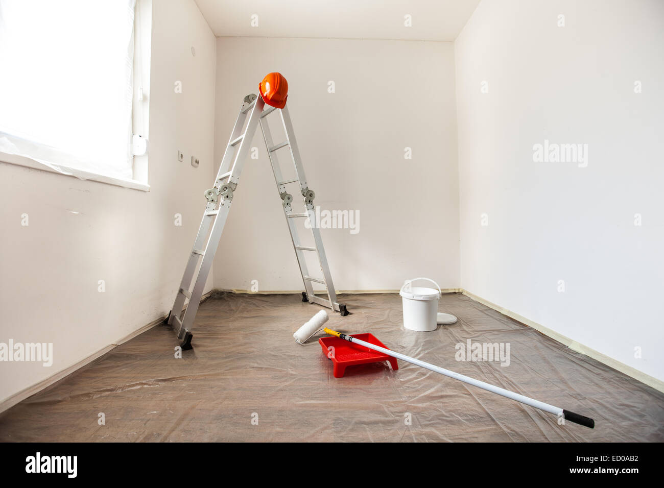 Several painting tools prepared for painting a room. Stock Photo