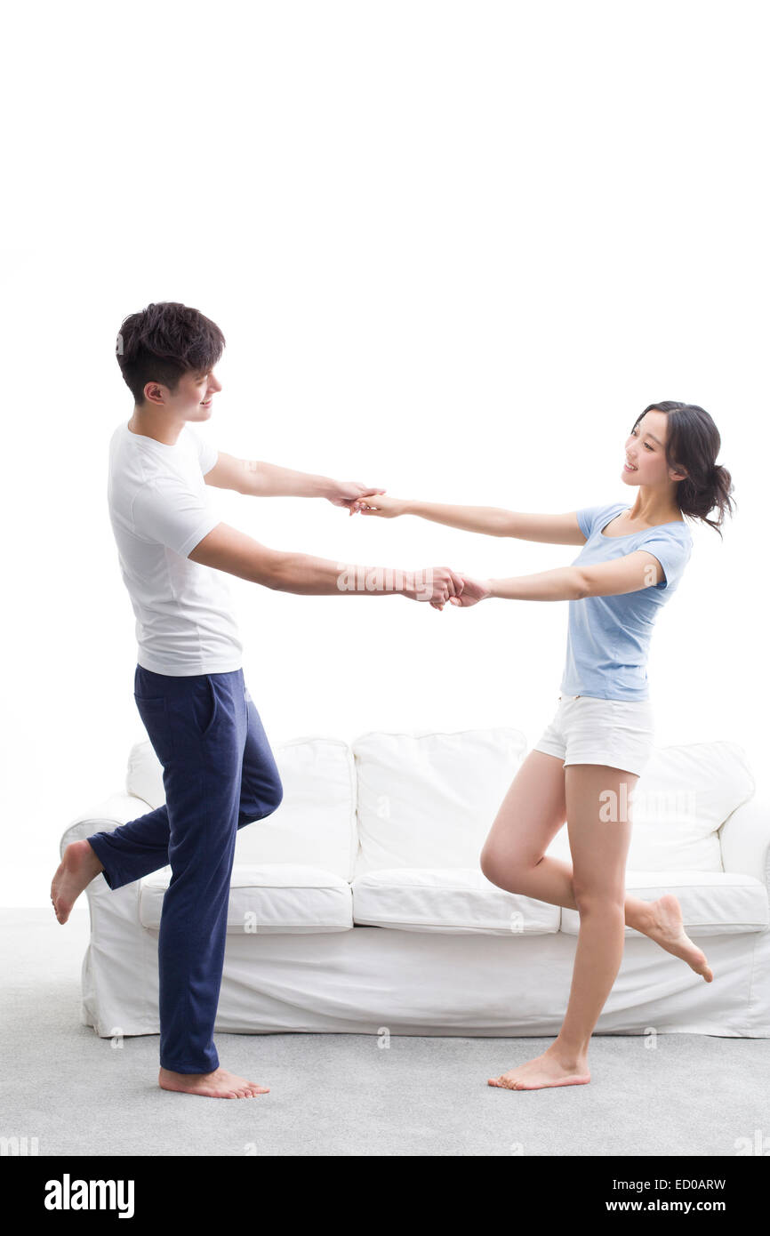 Happy young couple holding hands Stock Photo - Alamy