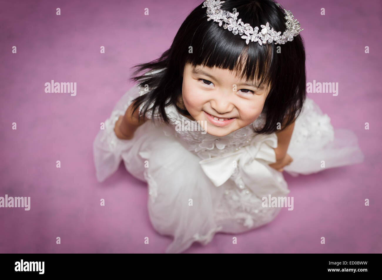 Portrait of smiling girl wearing wreath Stock Photo - Alamy