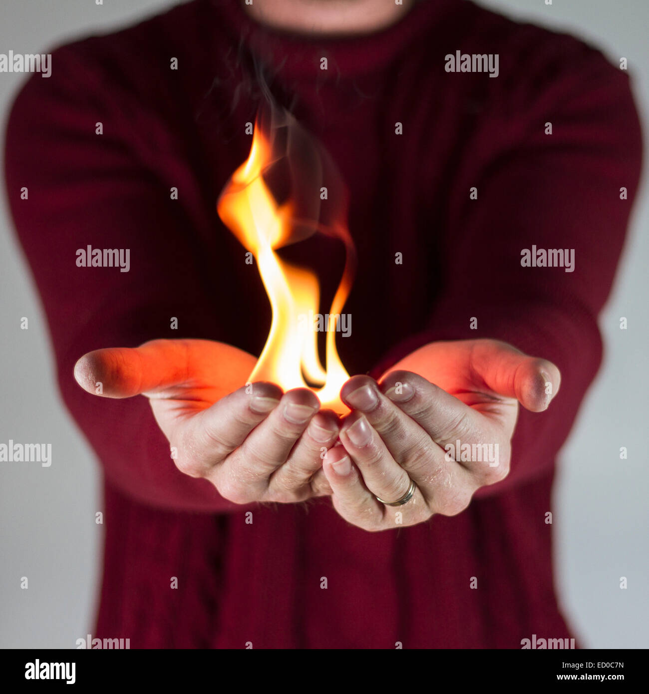 Man holding fire Stock Photo Alamy