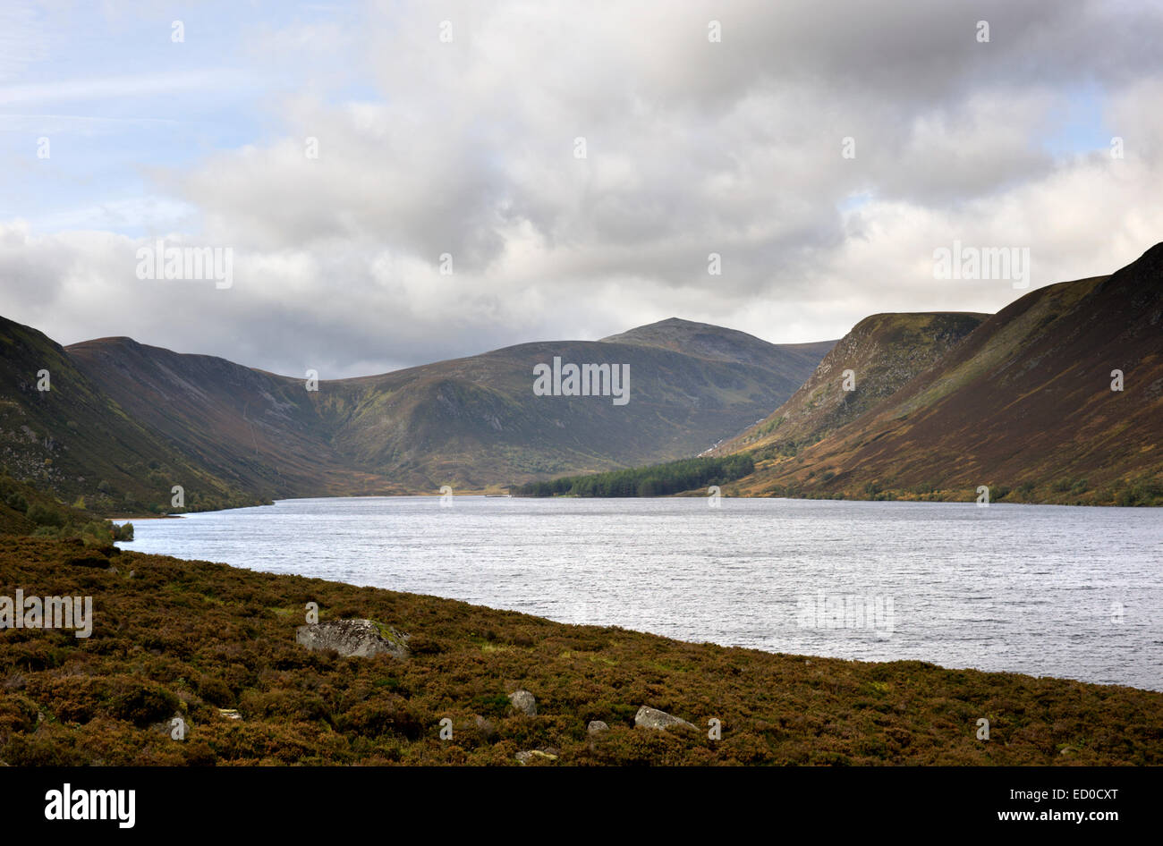 Looking across Loch Muick to Queen Victorias Glas allt Shiel and the surrounding mountains and hills Stock Photo